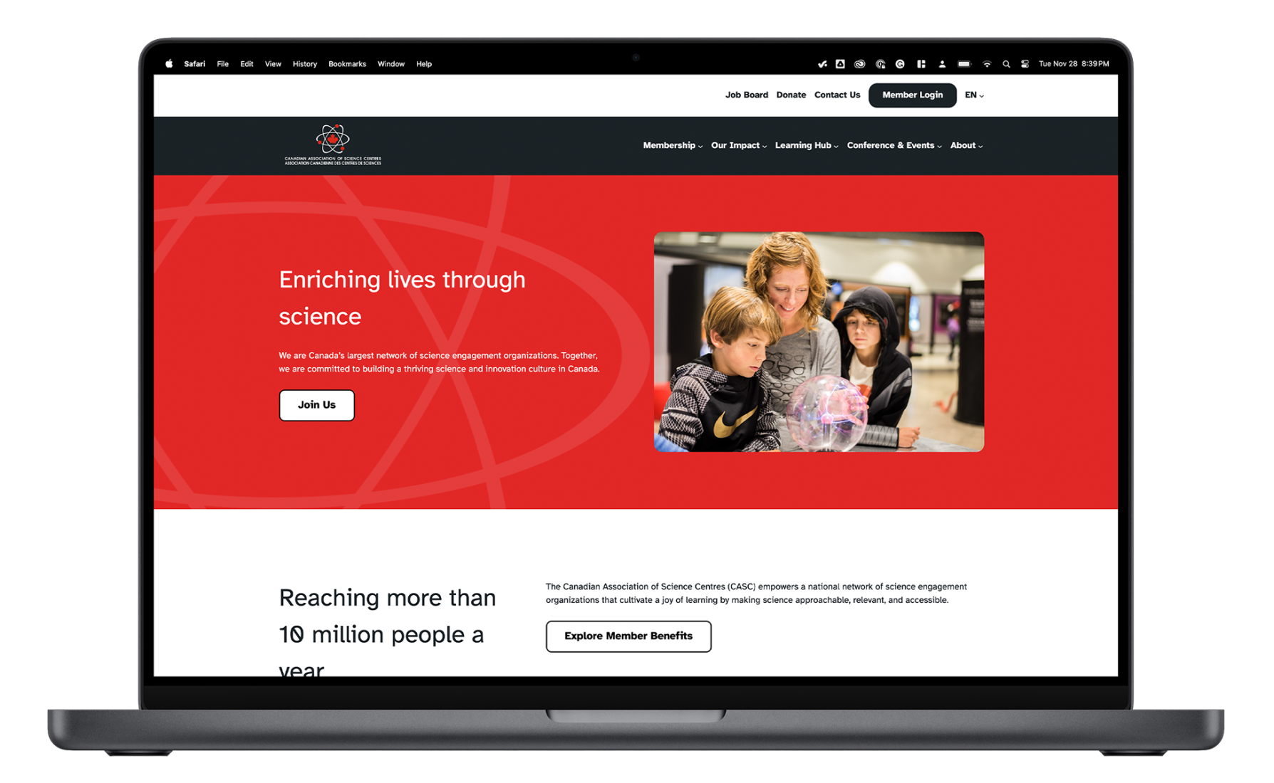 A mockup of the Canadian Association of Science Centres website displayed on a laptop, featuring the organization’s mission statement in a red banner.